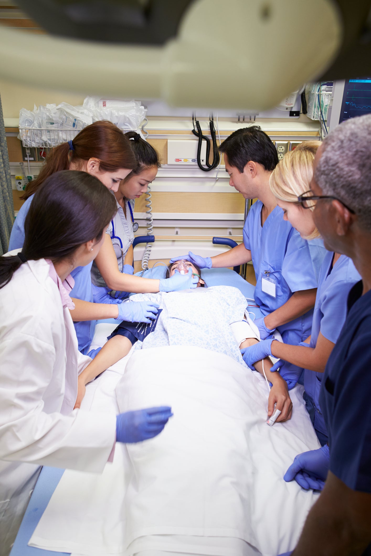 Medical Professionals providing custom care on a medical table